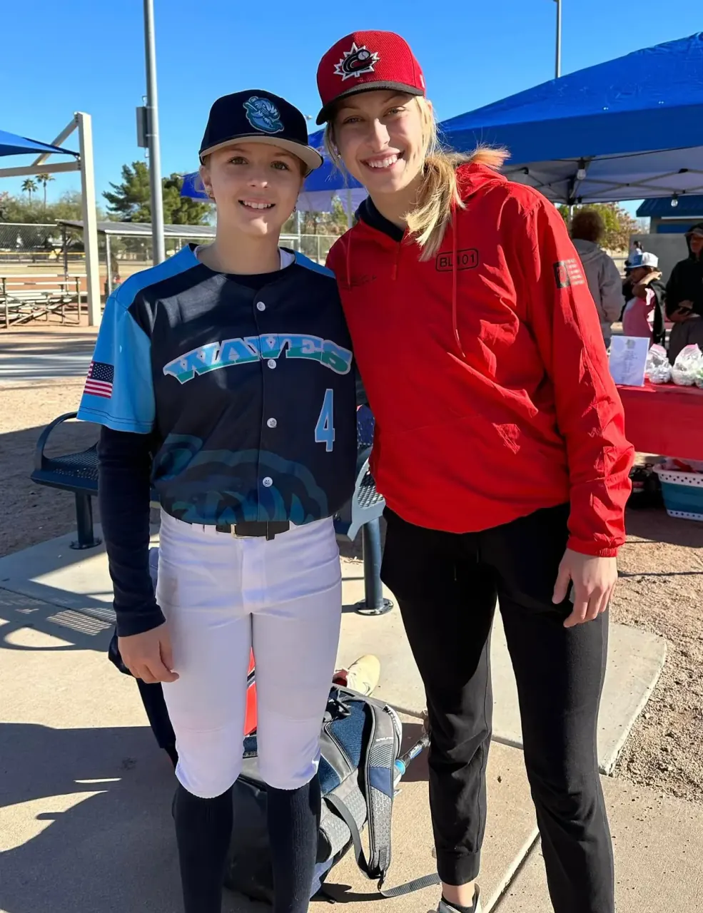 Finleigh Kane in a California Waves jersey standing with a teammate in a Team Canada jacket