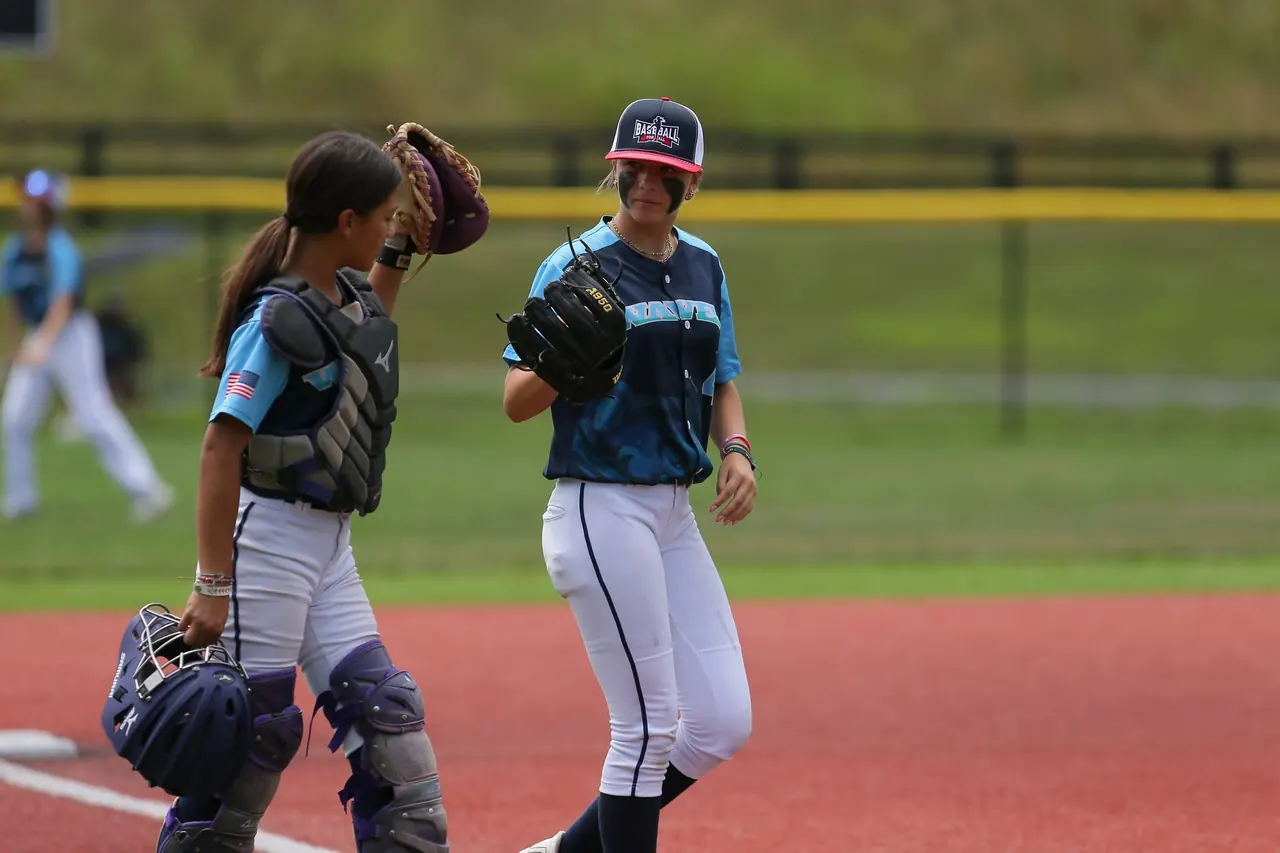 Finleigh Kane talking with the catcher during a California Waves game