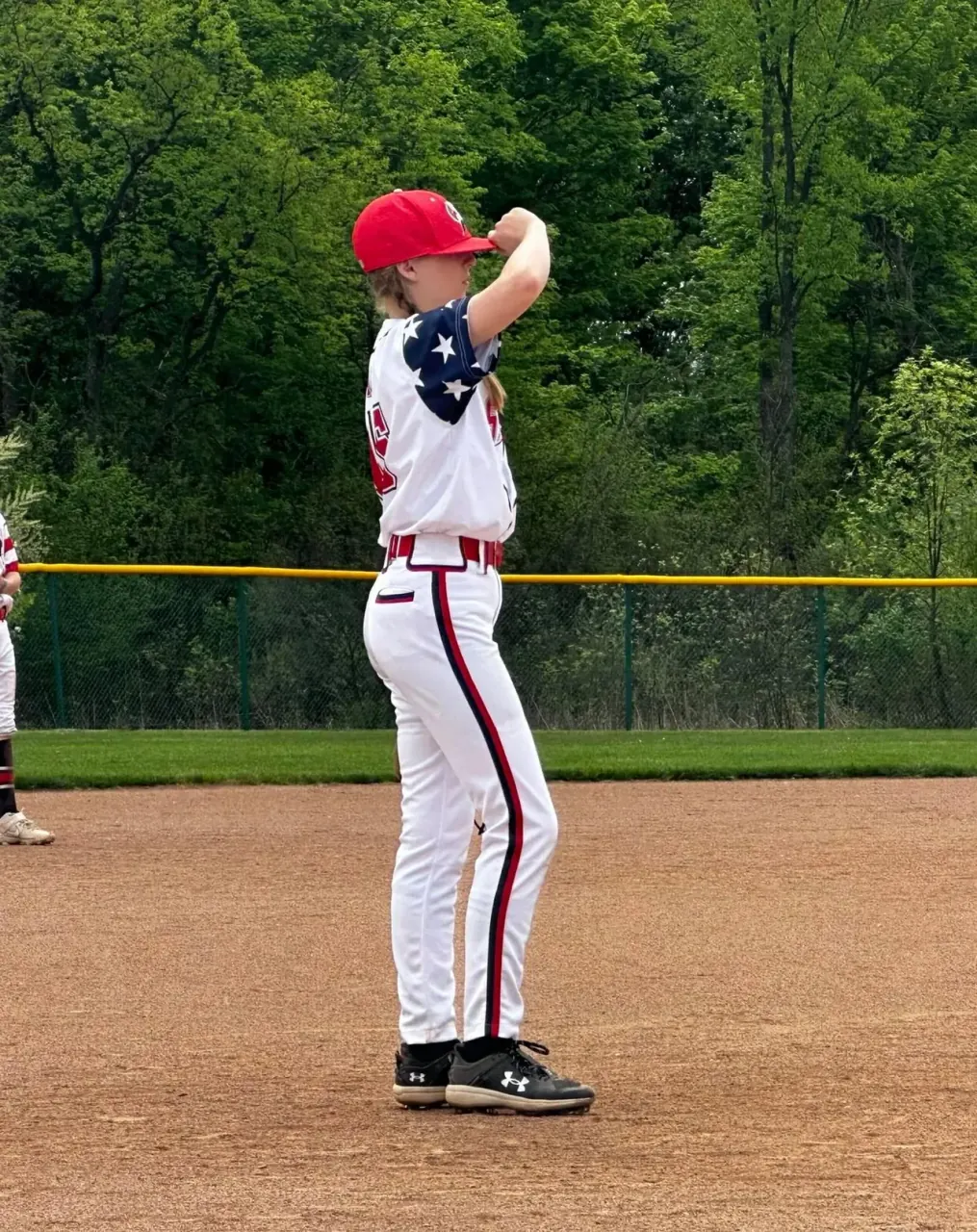 Finleigh Kane standing on the mound in a Detroit Metro Stars jersey