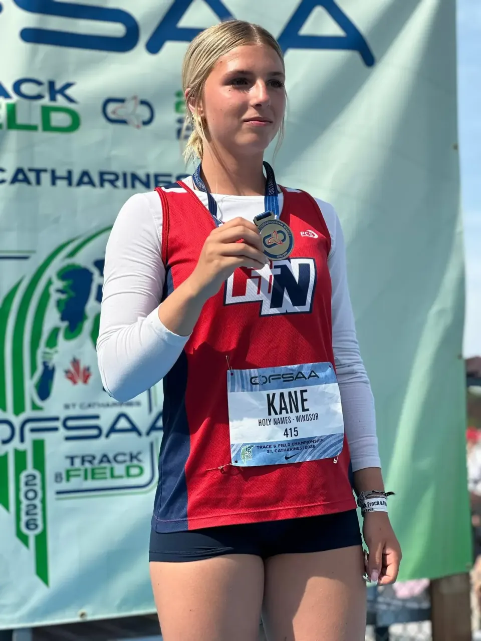 Finleigh Kane on the OFSAA podium with her javelin medal