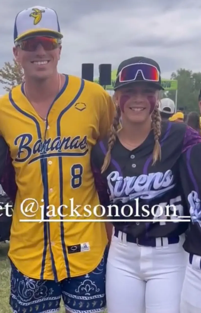 Finleigh Kane in a Sirens jersey standing with Savannah Bananas player Jackson Olson